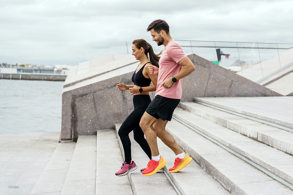 Runners running down stairs