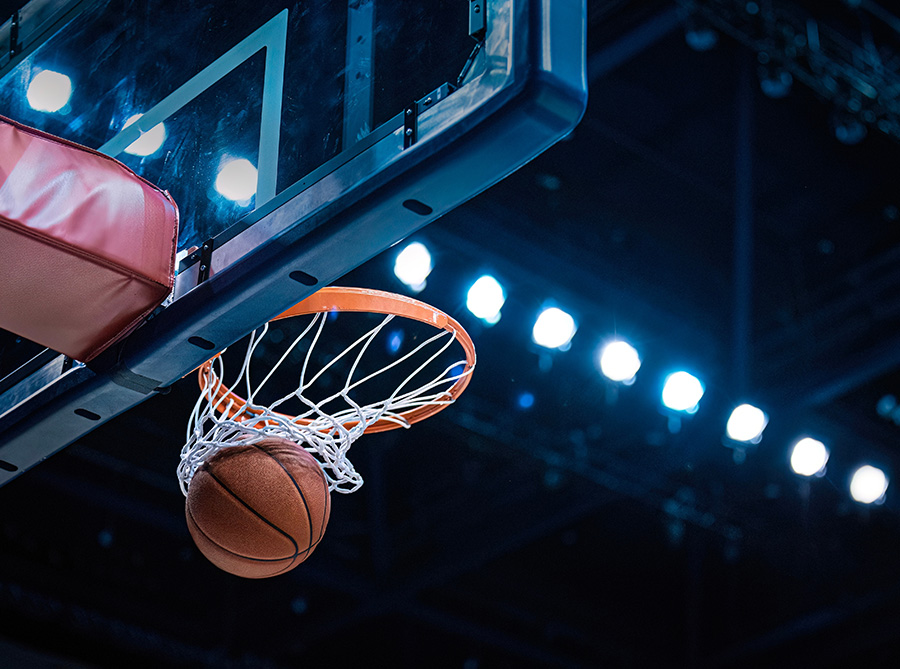 a ball going through a basketball hoop