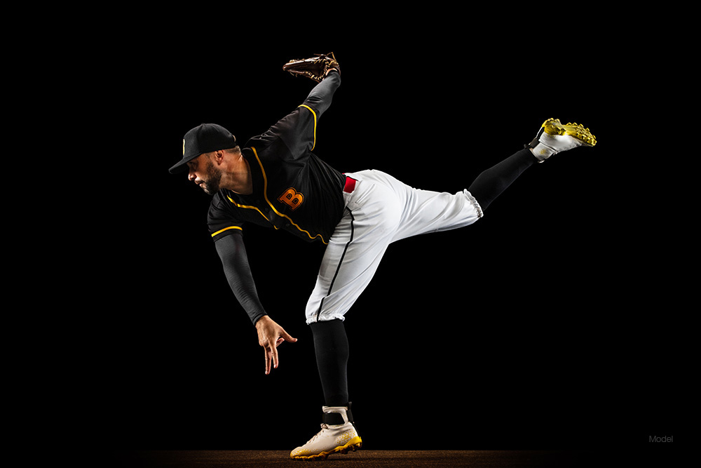 A baseball pitcher throwing a ball