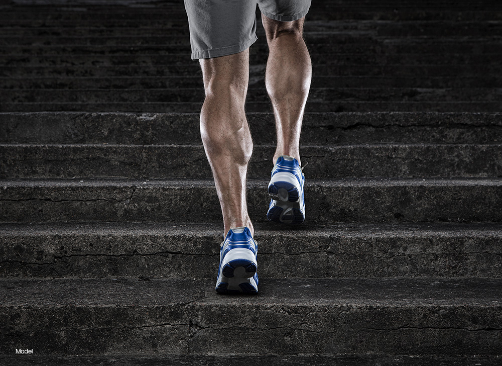 A fit man walking up the stairs